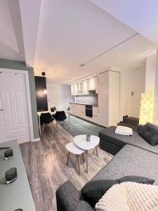 a living room with a couch and a table at Spacious and Beautiful Apartment in Bergen with free parking in Bergen