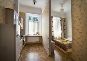 Кровать или кровати в номере Apart Hotel Kvartira 1