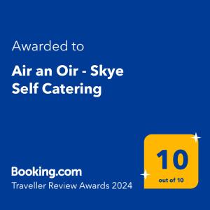 a yellow sign with the words air an air style self catering at Air an Oir - Skye Self Catering in Portree