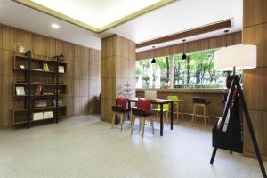 a dining room with a table and chairs at Hotel Morning Sky in Seoul