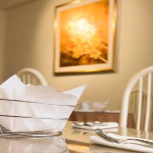 a table with a piece of paper on top of it at La Mansion Casa Hotel in Andahuaylas