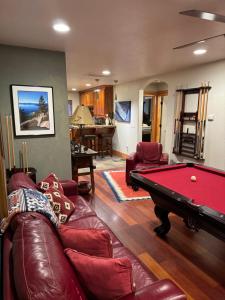 a living room with a pool table in it at Lake Tahoe Luxury Guest Quarters in South Lake Tahoe