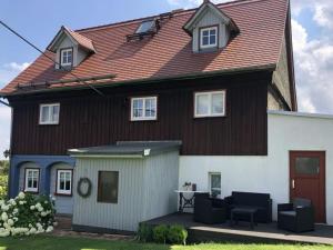 a large house with a large roof at Vincent family holiday home in Niederdorf