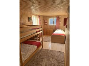 a small bedroom with two beds in a tiny house at Vincent family holiday home in Niederdorf
