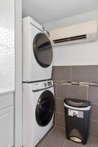 a washer and dryer in a kitchen with at Warm Villa 1 block to Mary Washington Campus in Fredericksburg