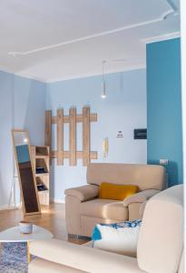 a living room with a couch and a table at Cane Apartment New Bazaar in Tirana