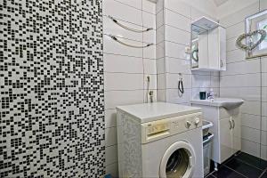 a bathroom with a washing machine and a sink at Apartments by the sea Postira, Brac - 22198 in Postira