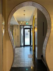 a hallway with an archway in a building at Den Basta hotel in Yangsan