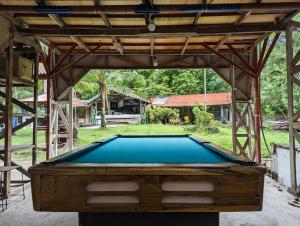 a pool table in a pavilion in a yard at Czar's Place in Siquijor