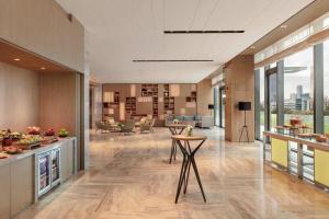 an office lobby with a view of the city at Courtyard by Marriott Shenzhen Bay in Shenzhen