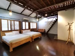 Postel nebo postele na pokoji v ubytování Mori Jonker Homestay