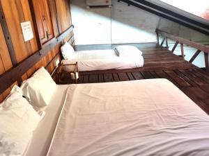 Postel nebo postele na pokoji v ubytování Mori Jonker Homestay