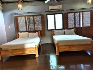 Postel nebo postele na pokoji v ubytování Mori Jonker Homestay