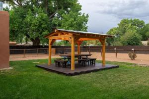 a picnic shelter with a picnic table in a park at Balloon fiesta home in Albuquerque