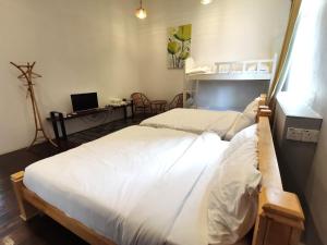 Postel nebo postele na pokoji v ubytování Mori Jonker Homestay