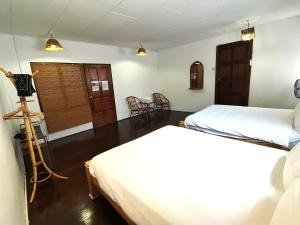 Postel nebo postele na pokoji v ubytování Mori Jonker Homestay