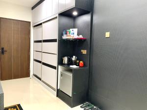 a kitchen with black and white walls and a door at Apartment with balcony-Modern-Nagoya-Spacious by Wiwi in Nagoya