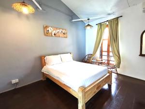 Postel nebo postele na pokoji v ubytování Mori Jonker Homestay