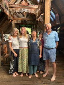 a group of people posing for a picture at BaanBooLoo Village in Chiang Mai