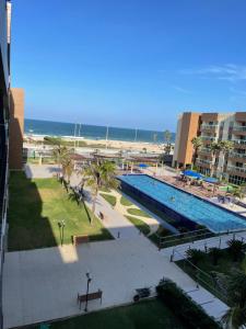 - Vistas a la piscina y a la playa en Apart Vg Fun, en Fortaleza