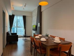 a dining room with a table and chairs at SA Sutera Avenue Homestay Kota Kinabalu Area KK City Opposite Imago in Kota Kinabalu