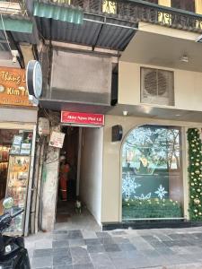 a store front of a building with a window at Nemohouse_homestay in Hanoi