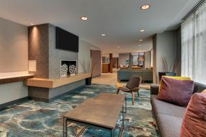 a living room with a couch and a fireplace at Fairfield Inn & Suites by Marriott Birmingham Downtown in Birmingham