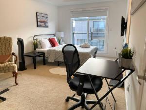 a bedroom with a bed and a desk and a chair at Dockside Luxury Living Bedroom Bathroom in Whitby