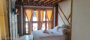 Postel nebo postele na pokoji v ubytování Villa Ester Hostel Vereda Cay