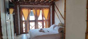Postel nebo postele na pokoji v ubytování Villa Ester Hostel Vereda Cay
