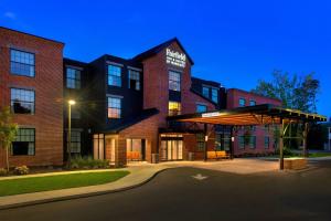 a brick building with a pavilion in front of it at Fairfield Inn & Suites by Marriott Williamstown in Williamstown