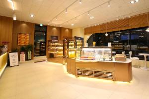 a store with a counter in the middle of a room at MGM Hotel in Gangneung