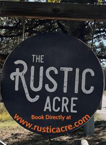 a sign for the rustic age book directory at theresartifacts at Sundance Suite, 1 Bedroom with fireplace Dogs OK in Estes Park