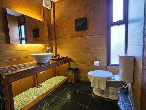 a bathroom with a sink and a toilet at R1 Resort Rajapruek Chiangmai in Chiang Mai
