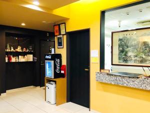 a fast food restaurant with a counter and yellow walls at WEB Hotel Tokyo Asakusabashi - Vacation STAY 13758v in Tokyo