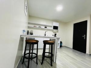Kuchyň nebo kuchyňský kout v ubytování Apartamentos AEROPUERTO