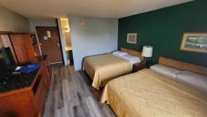 Lova arba lovos apgyvendinimo įstaigoje The Belgium Inn & Suites