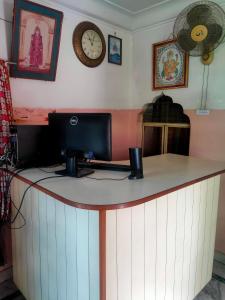 a counter with a computer on top of it at JWALA JAIPUR in Jaipur