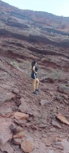 a woman standing on top of a mountain at tranquilidad absoluta in Villa Unión