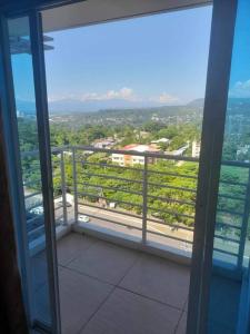 a balcony of a building with a view of a city at Uptown Condo Primavera Residences in Cagayan de Oro