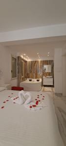 a bedroom with a bed with red roses on it at B&B Confort in Reggio di Calabria