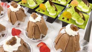 a display of cakes and strawberries on a table at Chateraise Hotel Nagano in Nagano