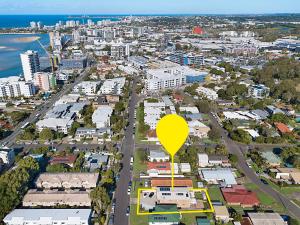 an aerial view of a city with a yellow hot air balloon at Popular Central Coastal Apartment in Maroochydore +5 photos