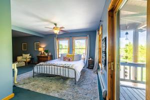 a bedroom with a bed and a ceiling fan at Point Au Roche Lodge in Plattsburgh
