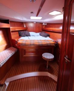 a cabin of a boat with a bed in it at blu in Cagliari