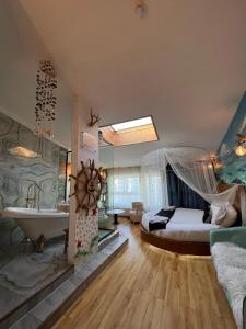 a bedroom with a bed and a tub and a sink at Nomado Boutique Hotel in Ulaanbaatar