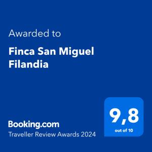 תעודה, פרס, שלט או מסמך אחר המוצג ב-Finca San Miguel Filandia