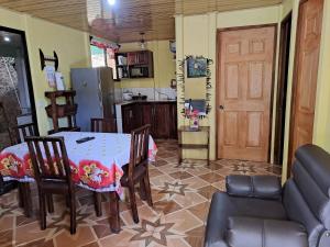 a kitchen and dining room with a table and chairs at CASA EQUIPADA SAN IGNACIO DE ACOSTA 