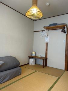 Postel nebo postele na pokoji v ubytování Guesthouse Hakuka