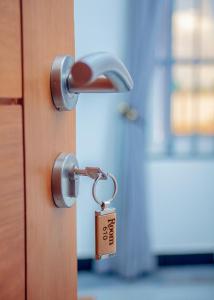 a lock on a door with a key at Teranga Lodge and Restaurant in Ihumwa